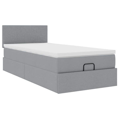 Lit ottoman avec matelas gris clair 90x200 cm tissu