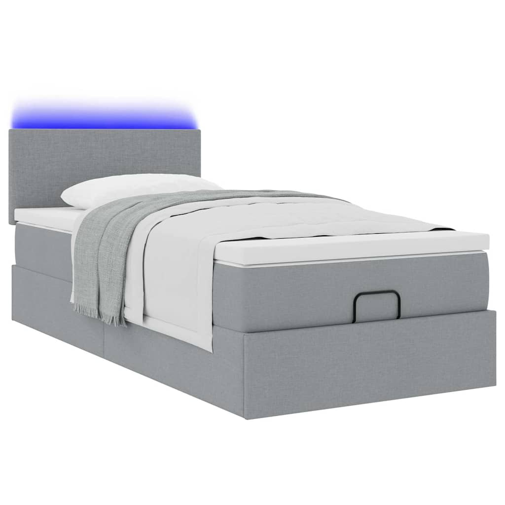 Lit ottoman avec matelas et LED gris clair 90x200 cm tissu