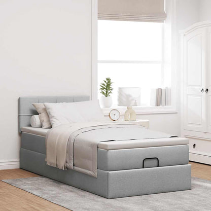 Lit ottoman avec matelas et LED gris clair 90x200 cm tissu