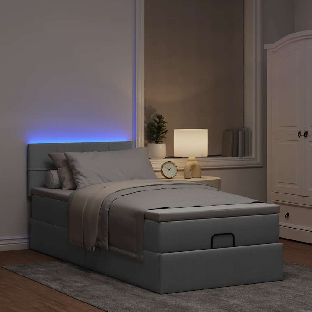 Lit ottoman avec matelas et LED gris clair 90x200 cm tissu