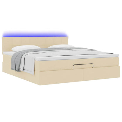 Lit ottoman avec matelas et LED crème 180x200cm tissu