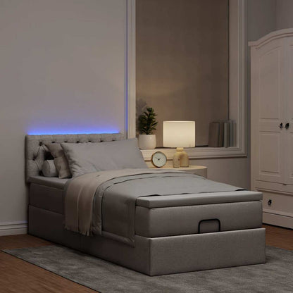 Lit ottoman avec matelas et LED taupe 90x200 cm tissu