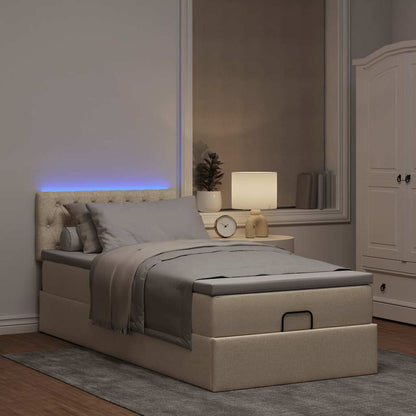 Lit ottoman avec matelas et LED crème 90x200 cm tissu