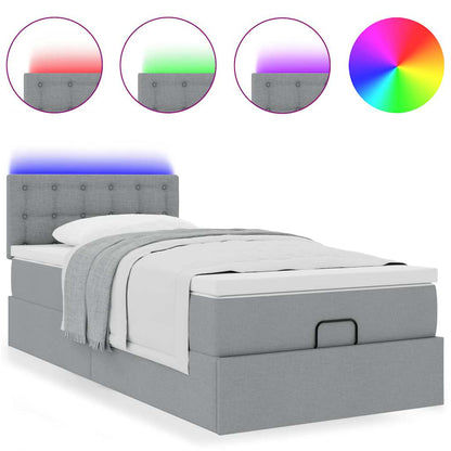 Lit ottoman avec matelas et LED gris clair 90x200 cm tissu