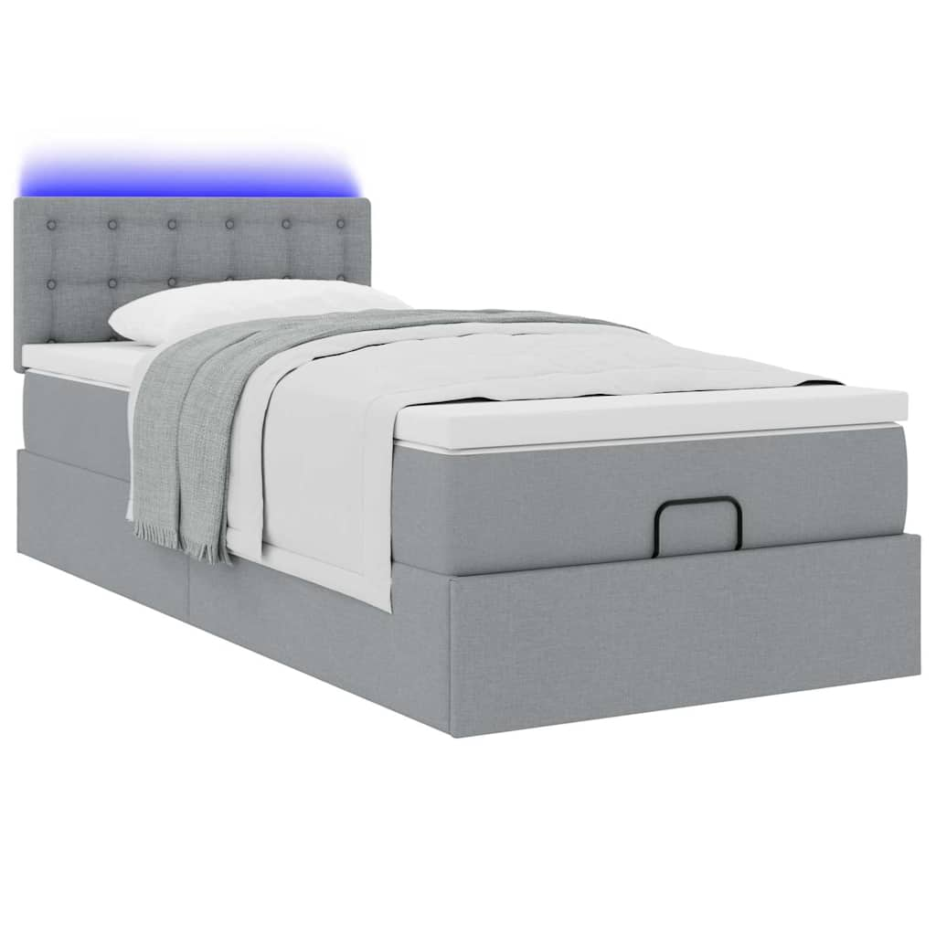 Lit ottoman avec matelas et LED gris clair 90x200 cm tissu